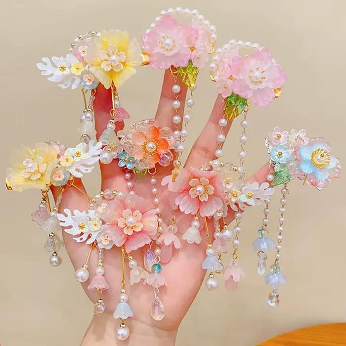 Pince à cheveux rose tendance avec fleur et pompon