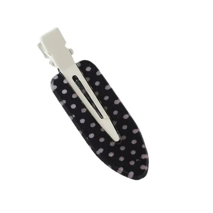 Pinces à cheveux en acrylique à pois noirs et blancs