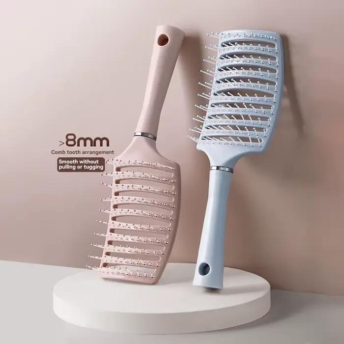 Brosse à cheveux avec coussin d'air
